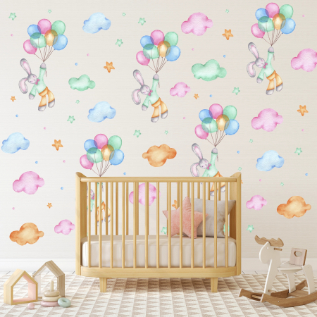Adesivi murali con un pattern di coniglietti e palloncini tra nuvole e stelline | Wall Decor Store